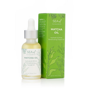 Our Matcha Oil sitting next to our Matcha Oil box with a white background.