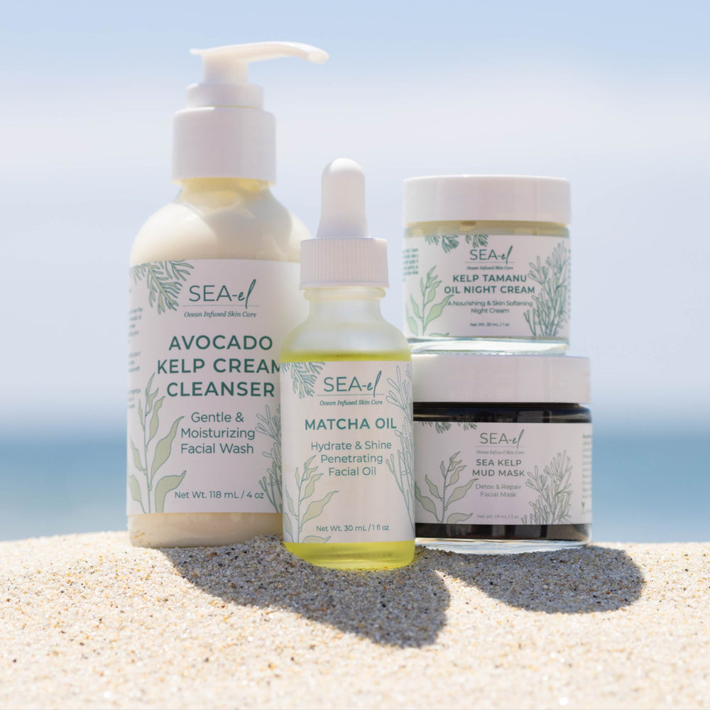 Image of one of Sea el Skincare bundles on the beach with the ocean in the backround.