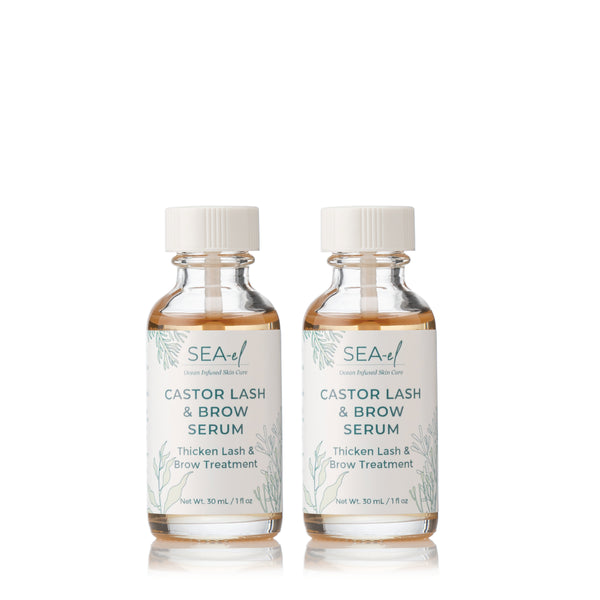Two clear glass bottles with white labels, labeled as Castor Lash & Brow Serum, designed for nourishing and conditioning eyebrows and lashes.