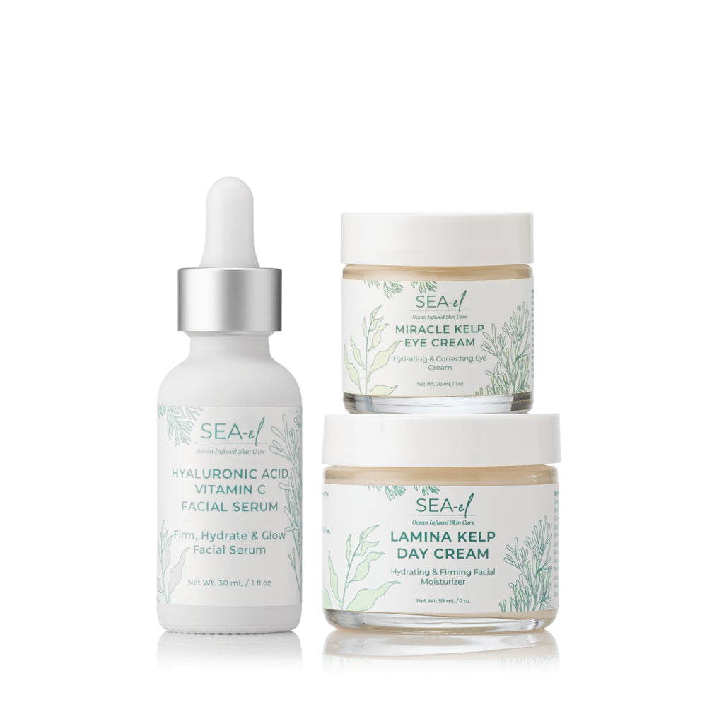 A set of three skincare products, including a serum, eye cream, and day cream from the brand SEA EL SKINCARE.