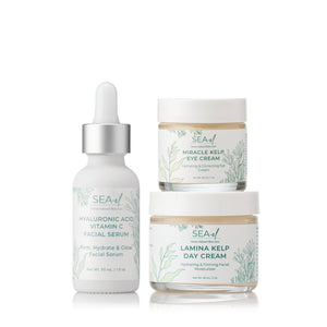 A set of three skincare products, including a serum, eye cream, and day cream from the brand SEA EL SKINCARE.