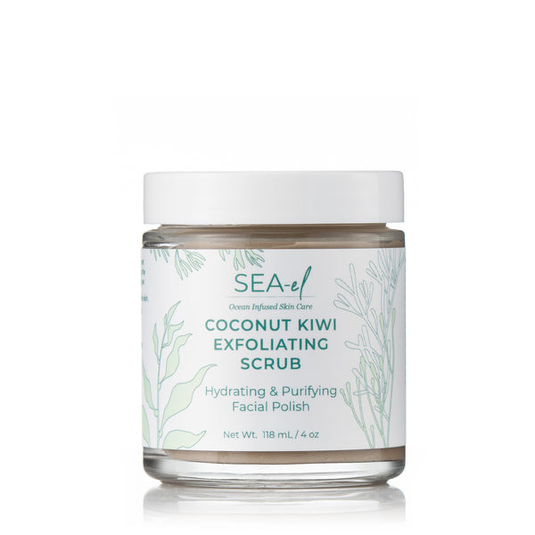 A jar of Coconut Kiwi Exfoliating Scrub with a white lid and label that includes botanical illustrations.