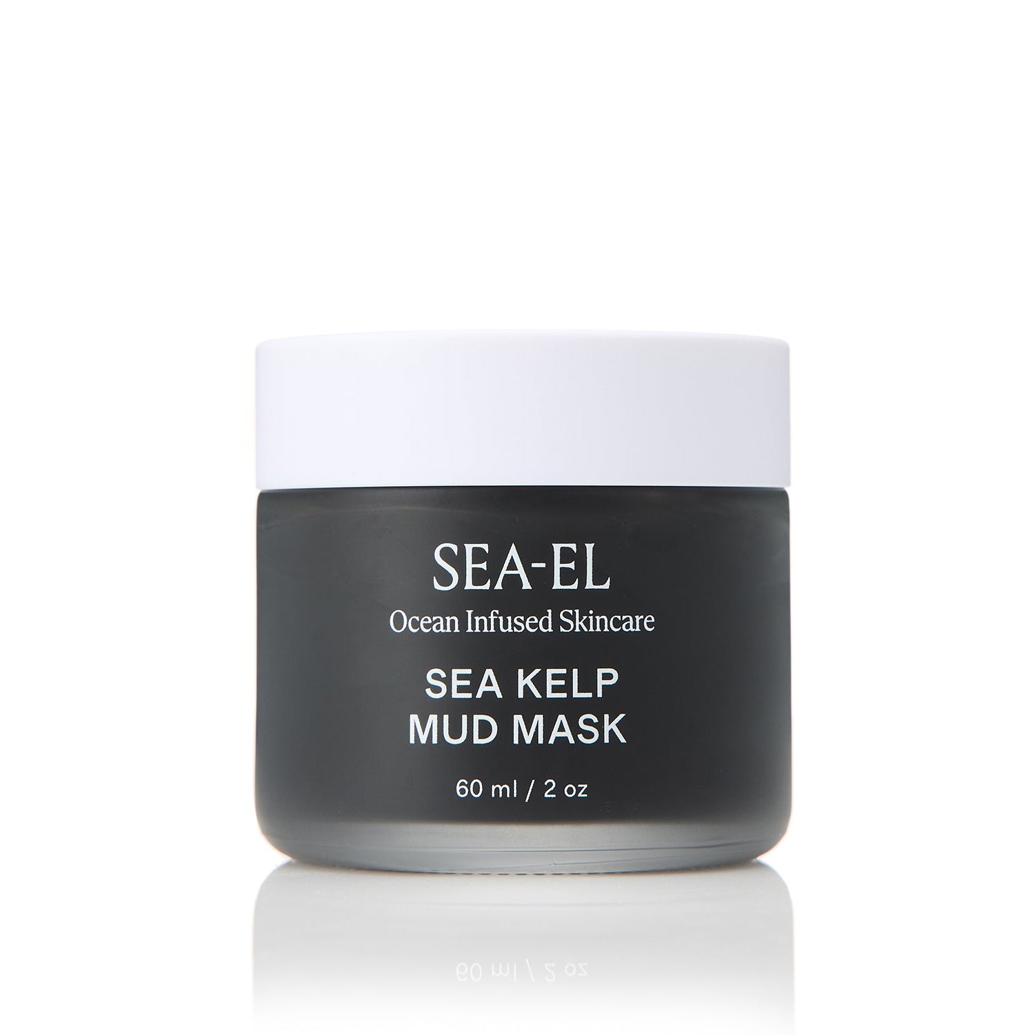 Sea Kelp Mud Mask that is in a frosted glass jar, where you can see the dark almost black material inside the glass.
