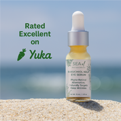 Bottle of Sea El Bakuchiol Kelp Eye Serum on sand with ocean background and 'Yuka' rating text.
