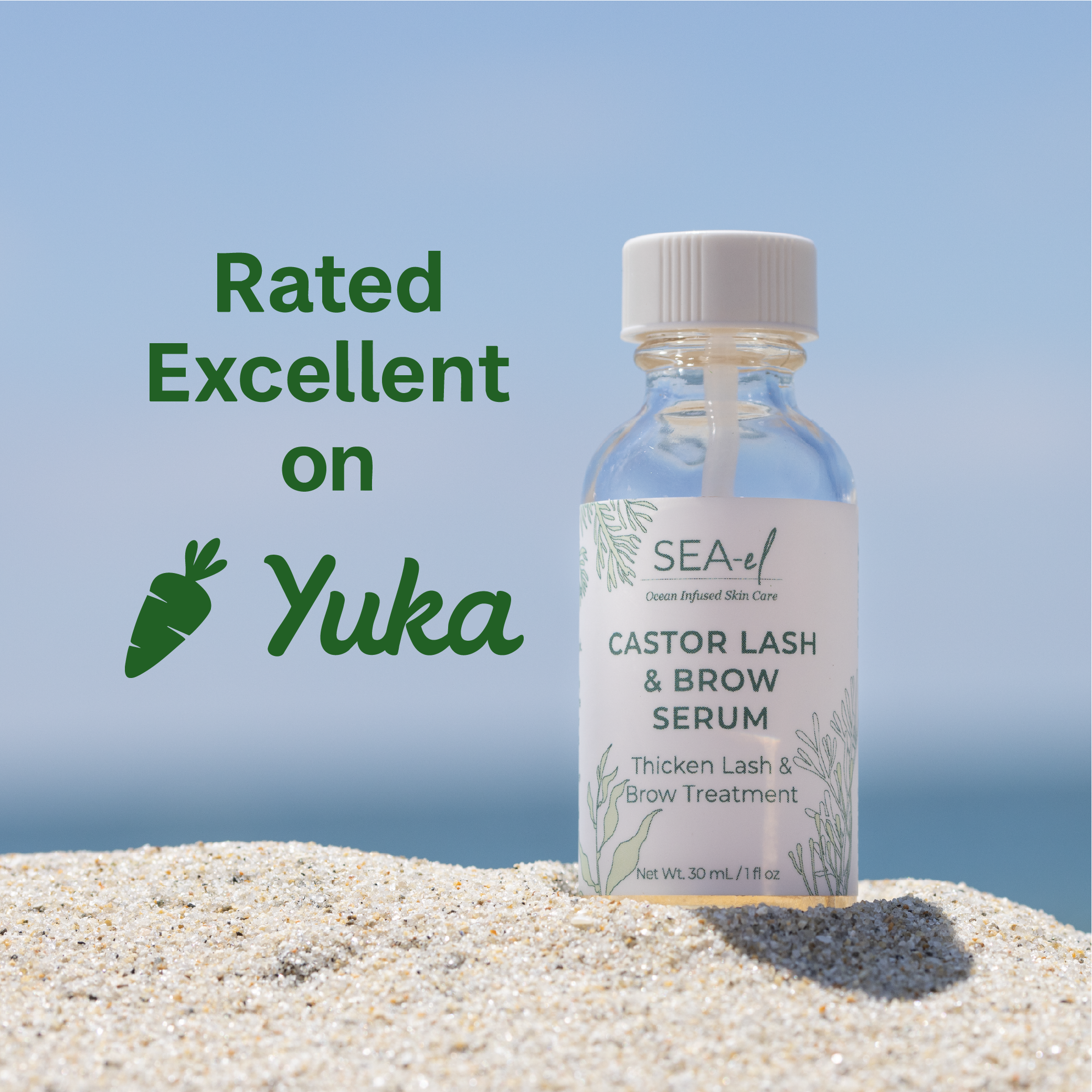 Bottle of Sea-El Castor Lash & Brow Serum on sand with a blue sky background. 