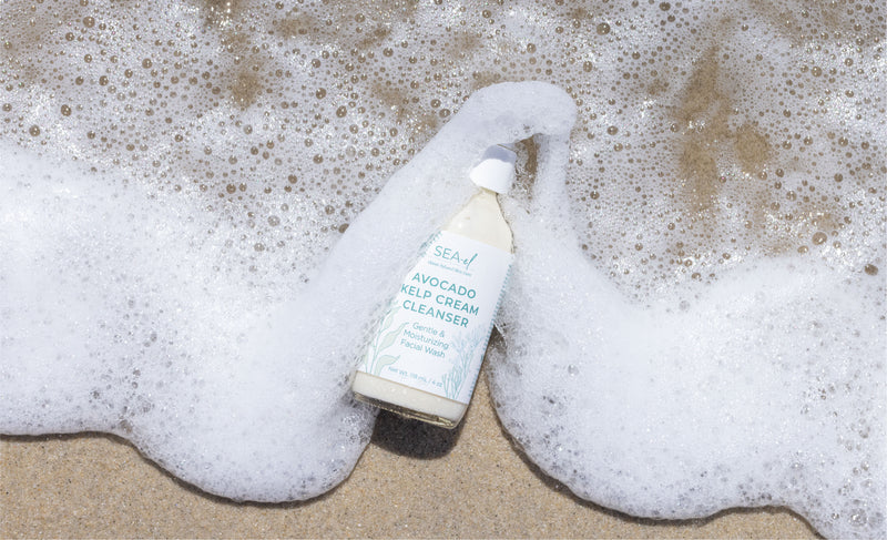 Product sitting on the ocean shoreline, covered by ocean water foam.