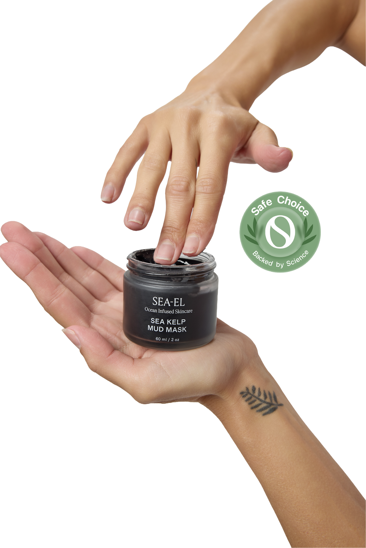 A person's hands holding an open jar of SEA-EL Sea Kelp Mud Mask against a white background, with a green Safe Choice Certified badge overlay on the right.