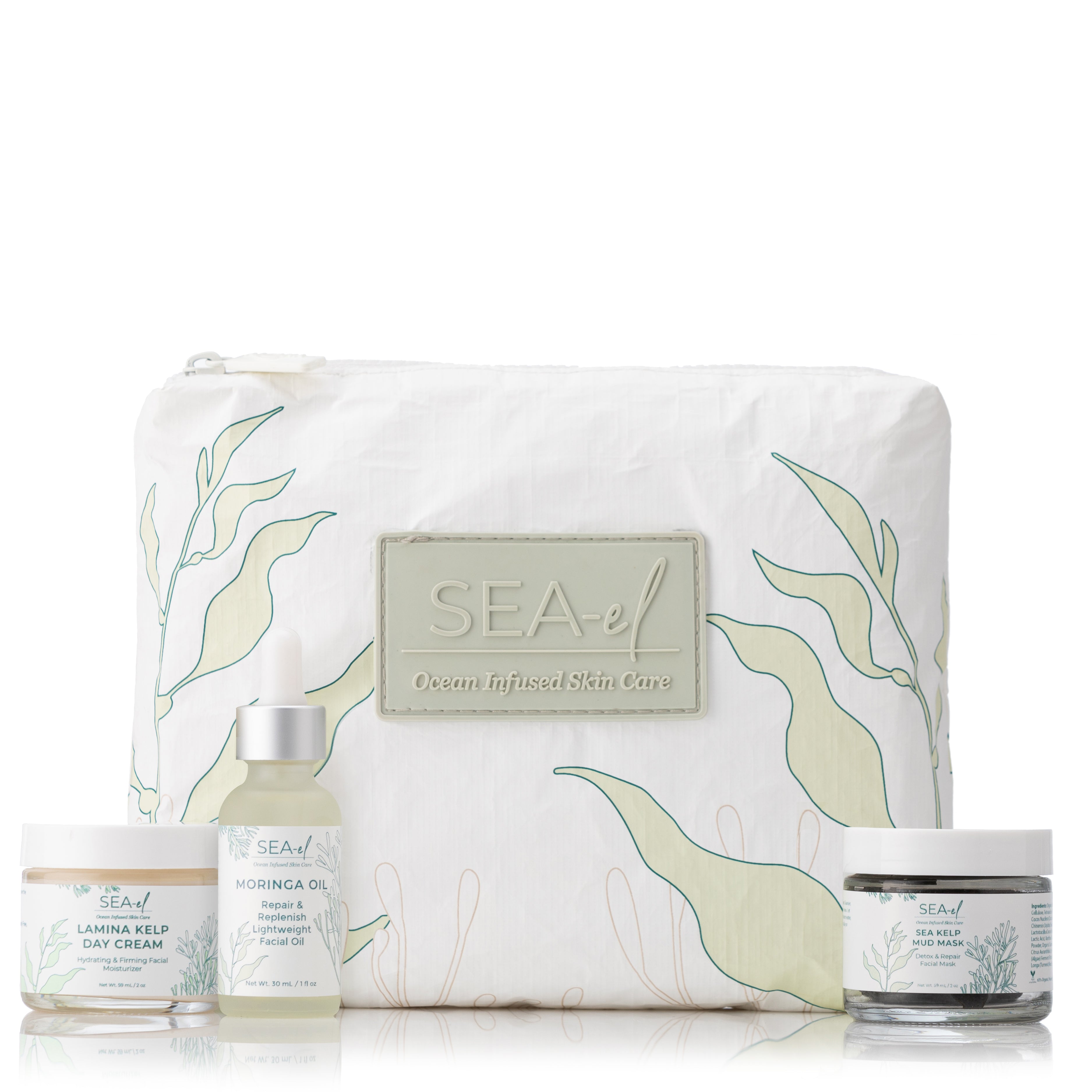 A product bundle containing skin care items including a day cream, an intensive moisturizing oil, and a sea kelp mud mask, presented with a white bag decorated with sea life illustrations.